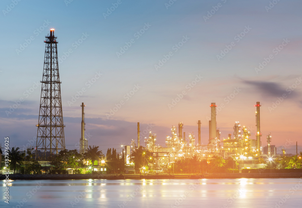 Refinery river front night view with after sunset sky background Refinery river front night view with after sunset sky background