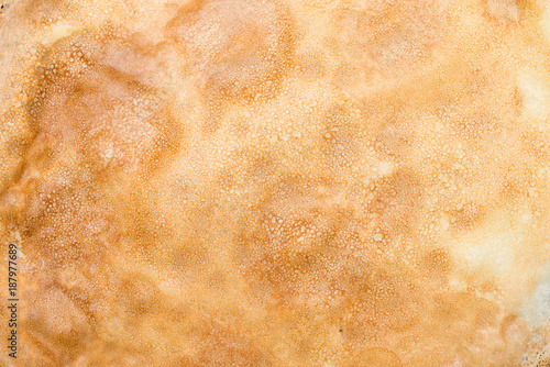 Close up texture of a pancake surface.