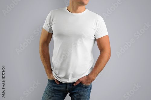Mockup white T-shirt on a young muscular guy