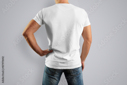 Mockup in a white T-shirt is looking from the back
