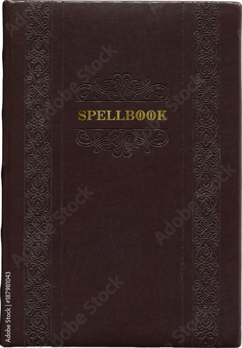 Old dark brown Spellbook isolated on a white background