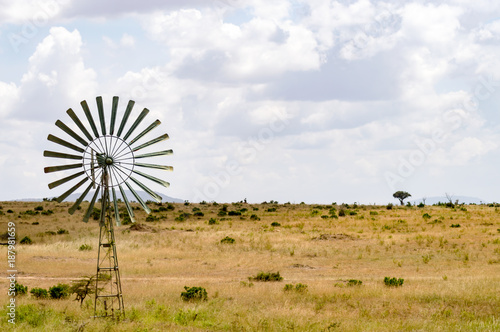 Water pump powered by a wind turbine in the savannah of the Masai Mara Park in Kenya