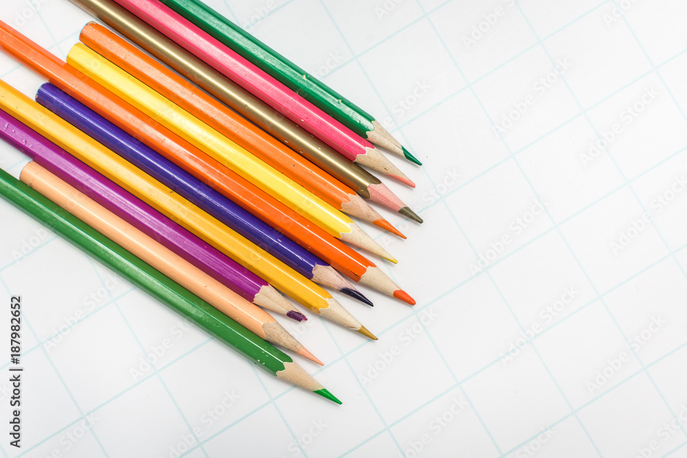 Fototapeta premium Colored pencils on white paper