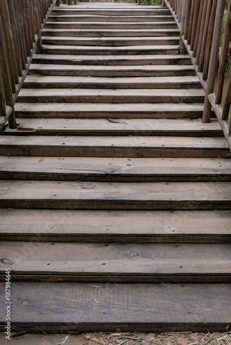 wooden stairs to a bridge