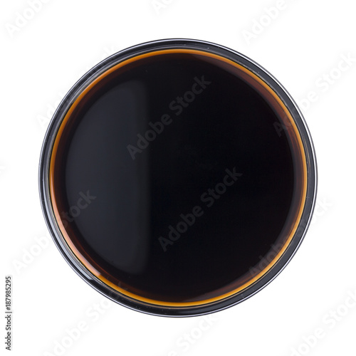 Soy sauce in bowl isolated on white background. Top view