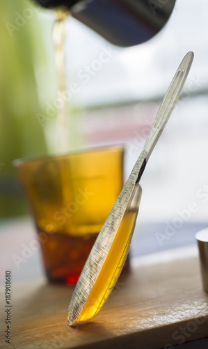 sealed single portion honey spoon