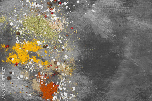 Various spices on a black background. Top view  copy space. Food background