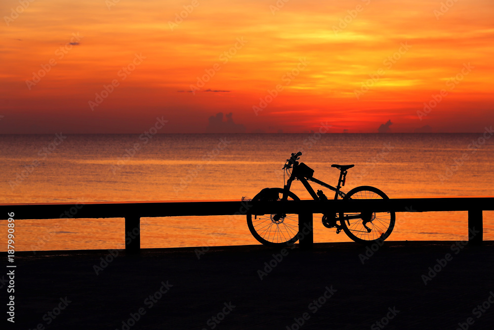 Silhouette bicycle outdoors against sunrise