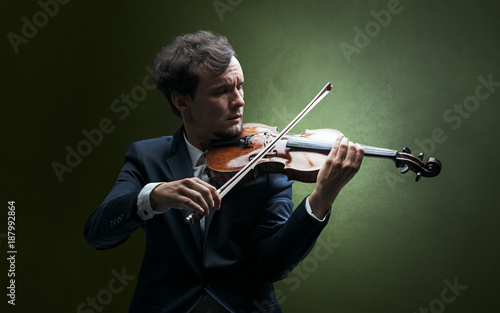 Violinst playing on instrument with empathy photo