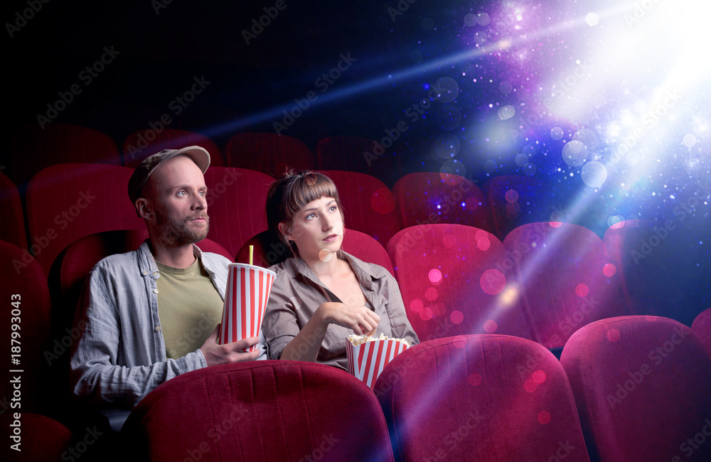 Naklejka premium Romantic couple sitting at spectacle