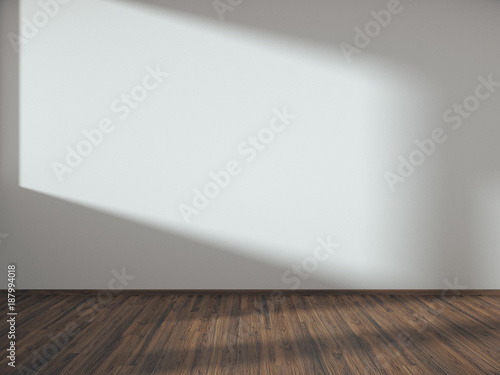 white empty room with light and shadow on wall