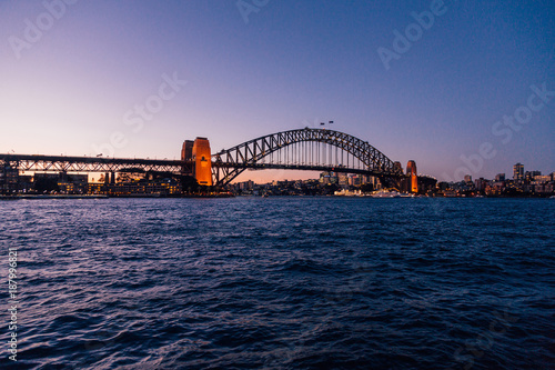 Photography Beautiful Sydney Opera house during sunset by the bay bridge and with people walking by