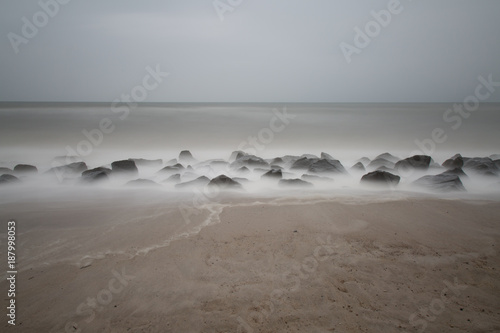 Schilderij op canvas Steinwall am Strand