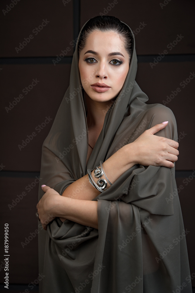 Fototapeta premium close-up portrait of beautiful young girl model with bright makeup, with jewelery with perfect clean skin