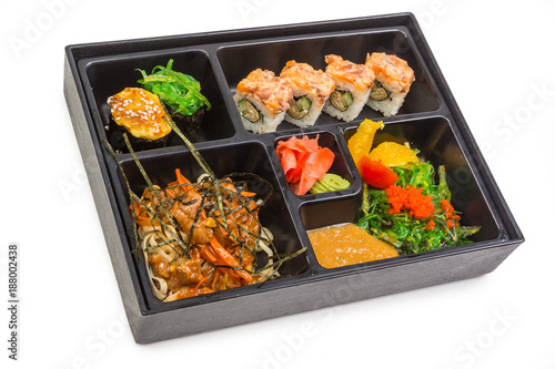 Sushi and roll set in bento box with seafood isolated on white background. Japanese cuisine.