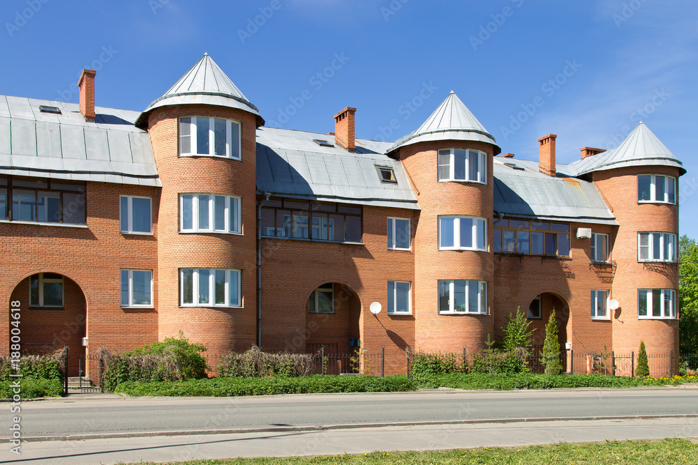 Modern three-story brick house with towers, Petrozavodsk, Russia