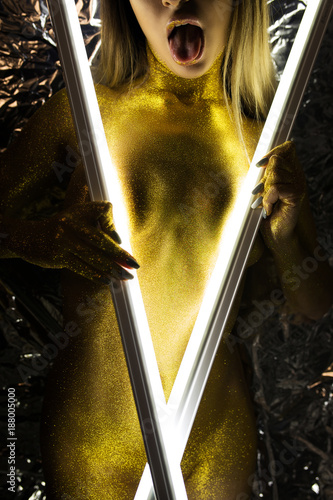 Samolepka Sexy beautiful woman with gold sparkles on the body.