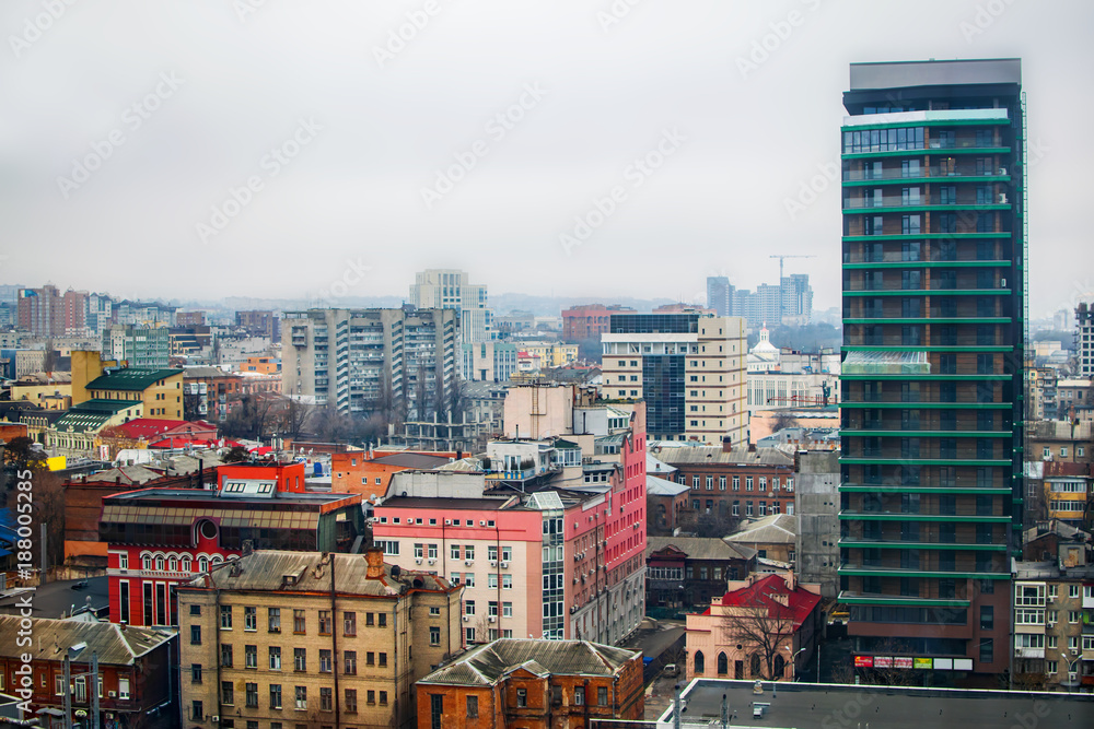 Rooftops of old and new modern city builddings. View of the winter Dnipro city in cloudy weather Rooftops of old and new modern city builddings. View of the winter Dnipro city in cloudy weather