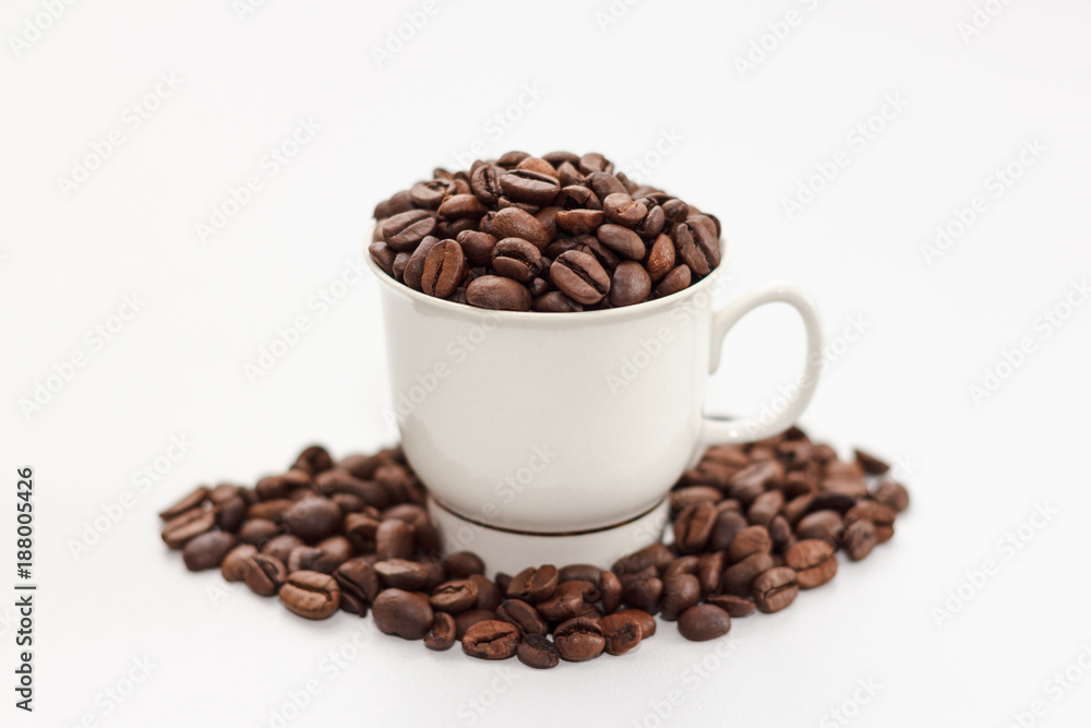 Coffee beans in coffee cup on white background Coffee beans in coffee cup on white background