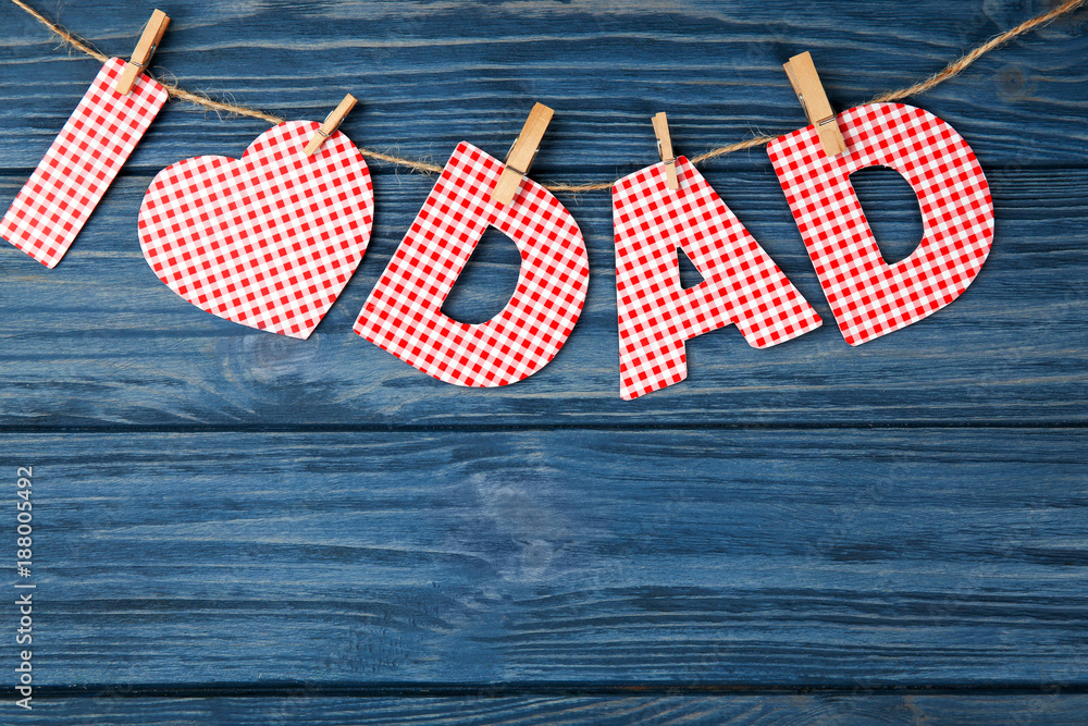 Obraz premium Composition with phrase I LOVE DAD for Father's Day on wooden background