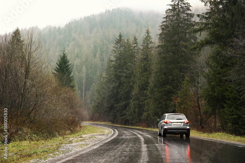 Car on country road in rainy weather © Africa Studio