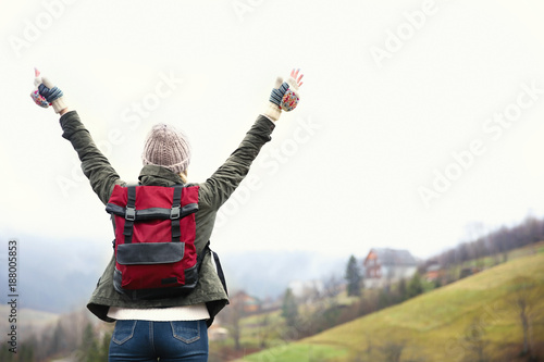 Happy tourist travelling in mountains