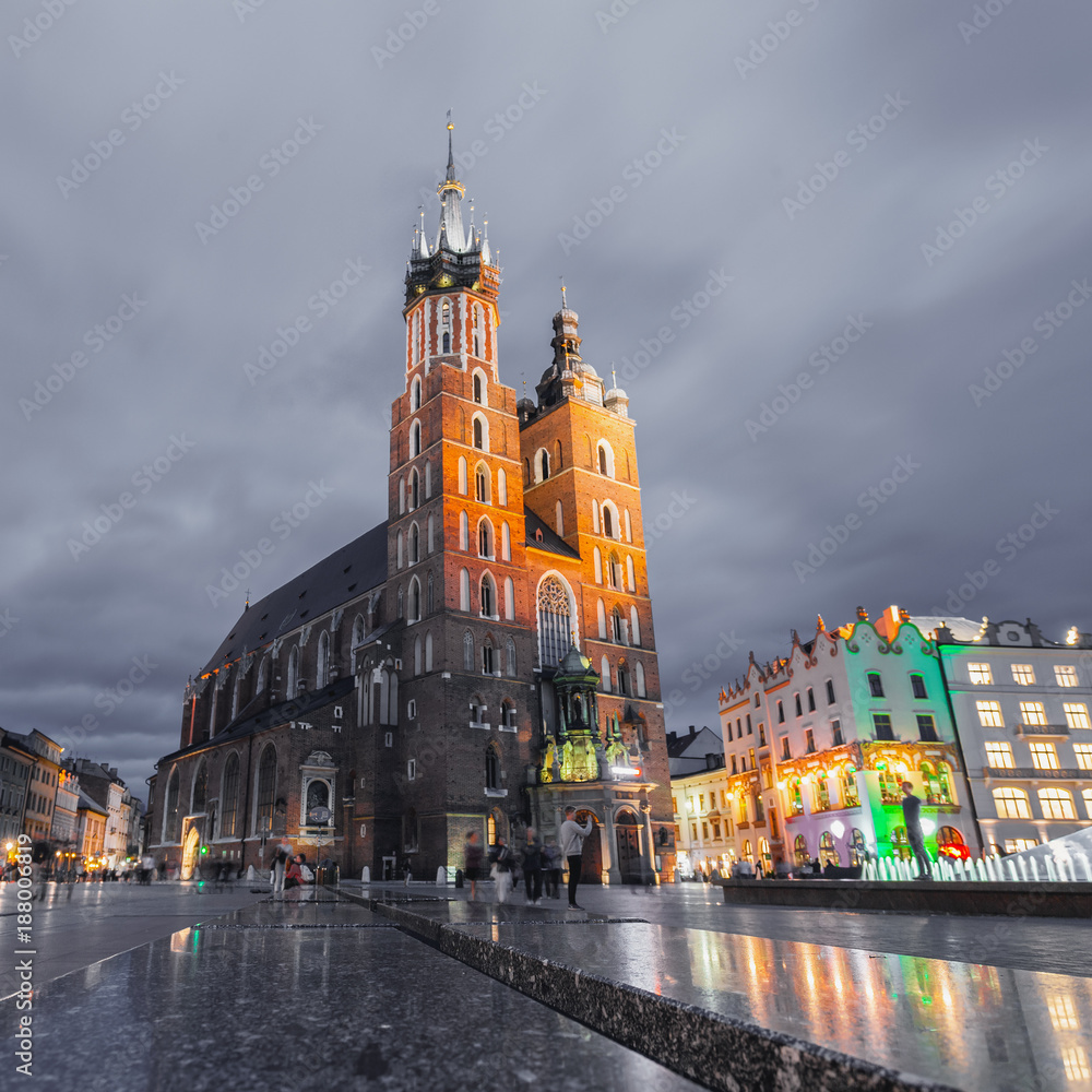 Fototapeta premium St. Mary's Church at night. Market Square - main square in old city. Krakow Poland.