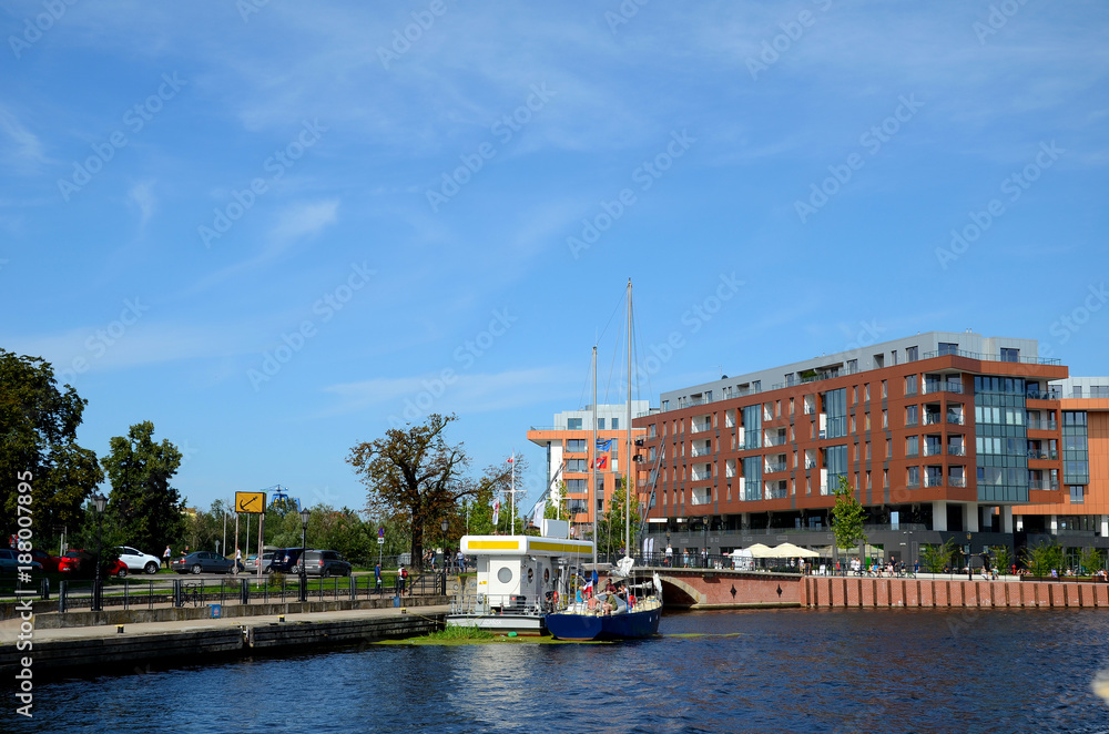 Fuel station for yachts on the background of a modern residential building in Gdansk (Poland)