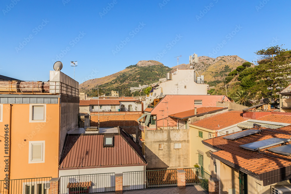 Letojanni, Sicily, Italy. Roofs of hotels and surrounding mountains