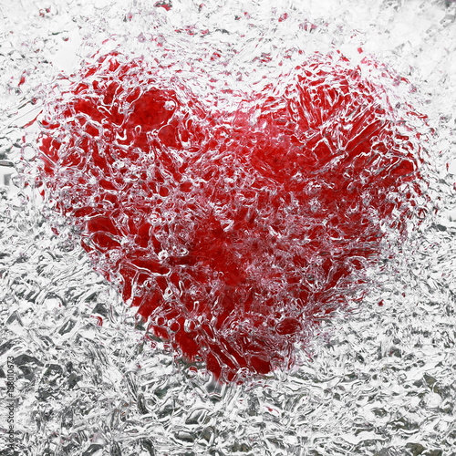 bright red heart symbol is covered with cold, clear ice