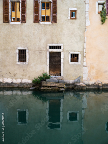 Old Wooden Door with reflection in the water © frederikloewer