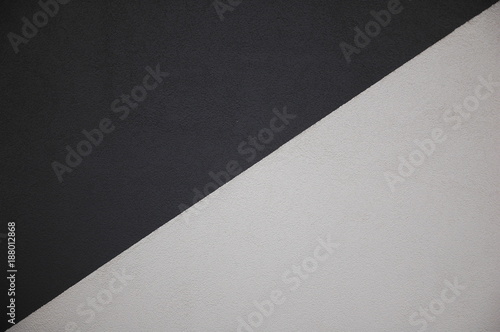 Abstract artistic background: a mixture of black and white diagonally.