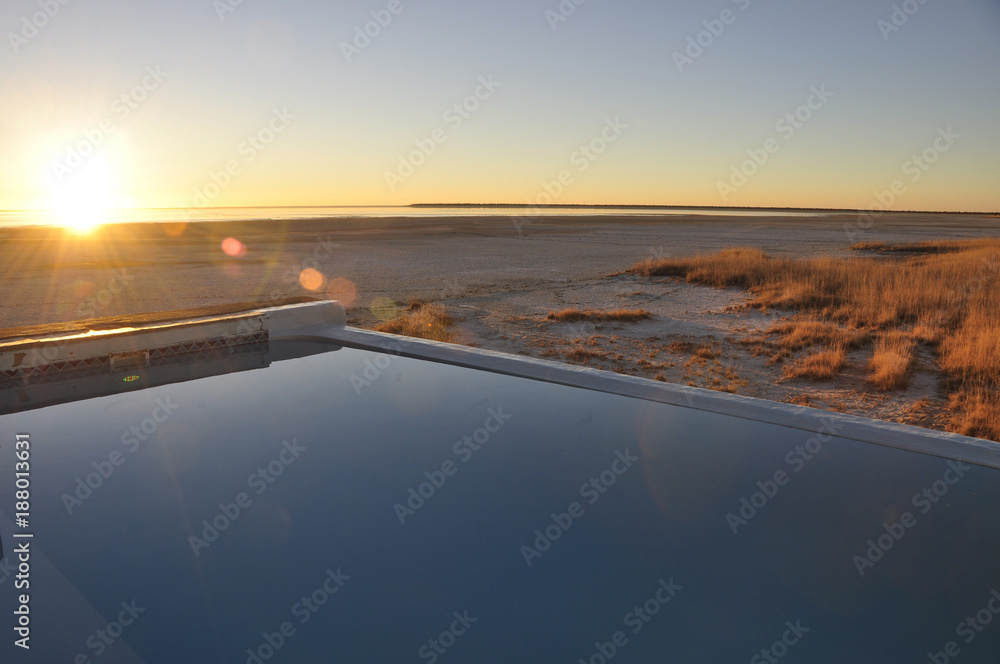 The champagne-poolo of Onkoshi Camp with breathtaking view over the Etosha Saltpans