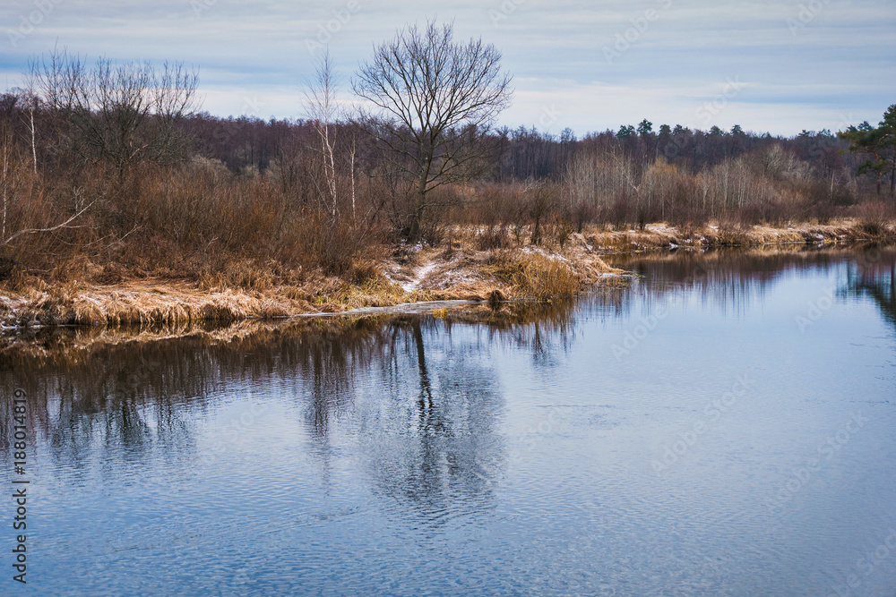 non-freezing river on winter forest backgrounds non-freezing river on winter forest backgrounds
