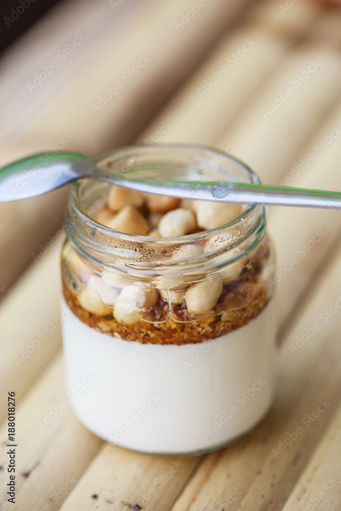 Glass jar with delicious yogurt Glass jar with delicious yogurt