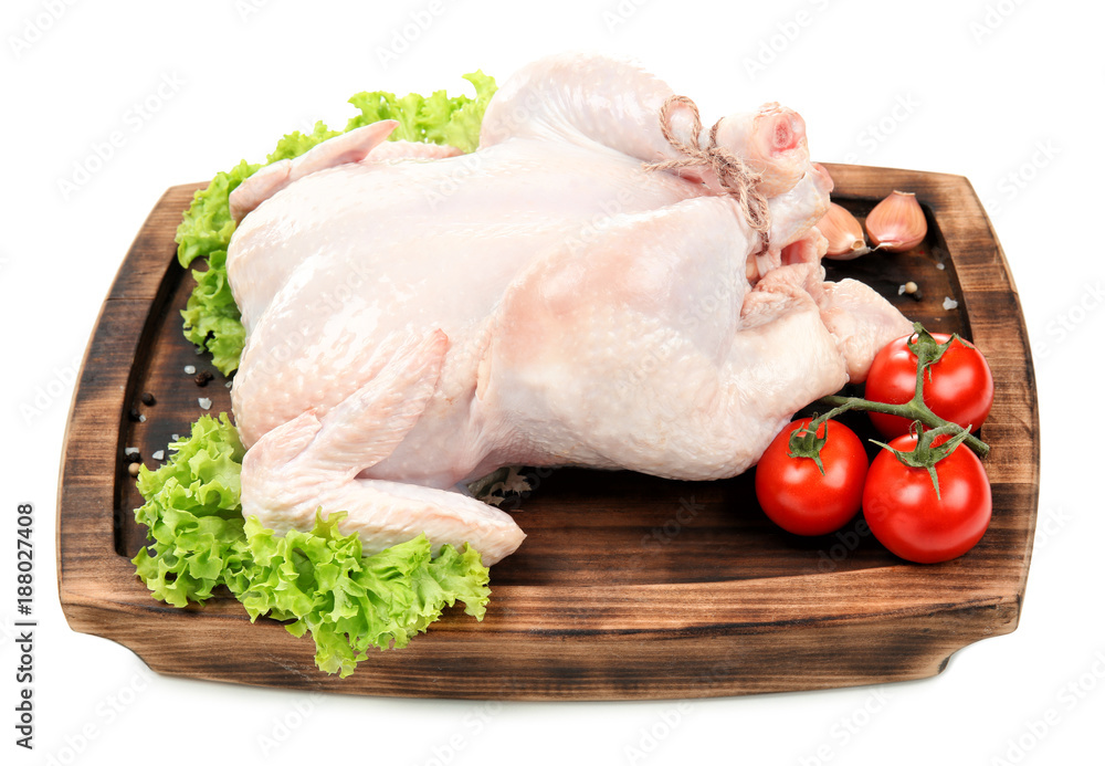 Wooden board with whole chicken, lettuce and tomatoes on white background Wooden board with whole chicken, lettuce and tomatoes on white background