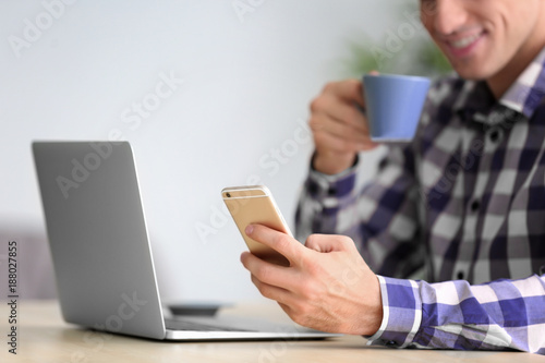 Man with smartphone using l...