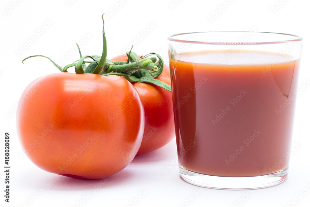 Glass with tomato juice and fresh tomatoes on white background Glass with tomato juice and fresh tomatoes on white background