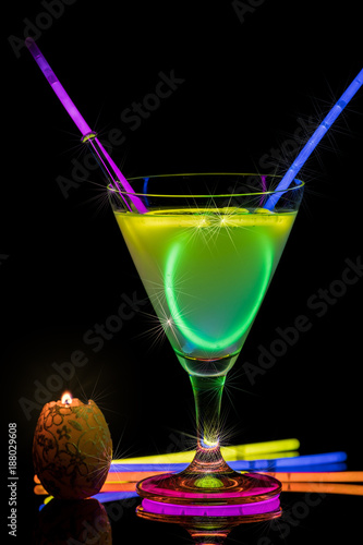 Cocktail with neon lights and candlelight