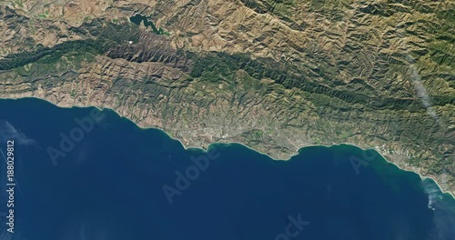 Very high-altitude overflight aerial of Pacific coast land, California. Clip loops and is reversible. Elements of this image furnished by USGS/NASA Landsat