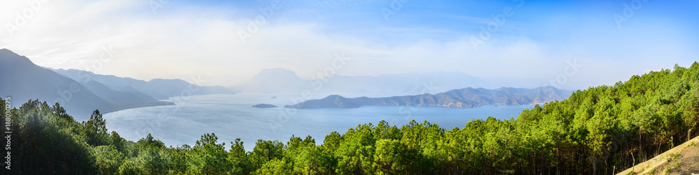 Panorama landscape of Lugu Lake. It is an alpine lake at an elevation of 2,685 metres. Located in Yunnan, China.