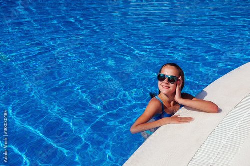 teen girl relaxing near swimming pool