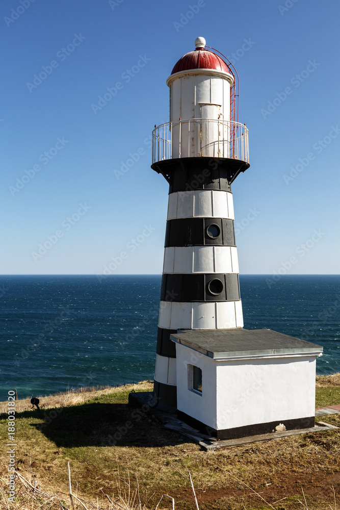 Petropavlovsky Lighthouse (founded in 1850) - oldest lighthouse in Russian Far East, located on Cape Mayachny on Kamchatka on shore of Avacha Gulf in Pacific Ocean, in vicinity of Petropavlovsk City.