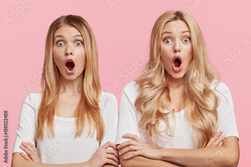 Shocked stupefied cute female students and groupmates realize that tomorrow is final exam at university, have no time for preparation, express big surprisment and amazement, afraid to fail it