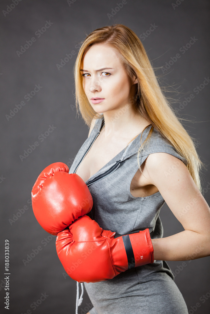 Beautiful woman with red boxing gloves