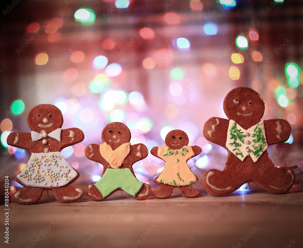 Obraz premium gingerbread house and gingerbread men on a festive background