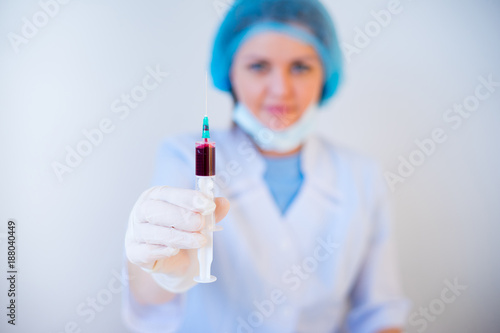 Doctor takes blood sample