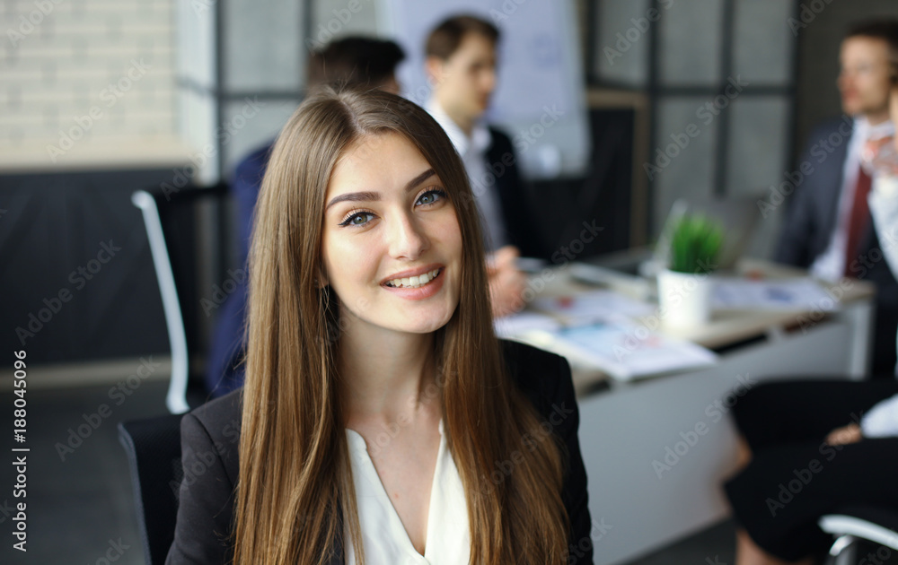 Fototapeta premium business woman with her staff, people group in background at modern bright office indoors.
