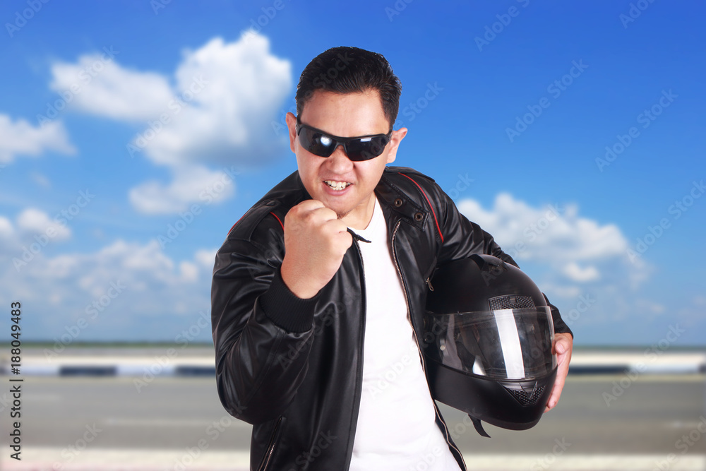 Angry Motorcyclist Biker Racer Show His Fist Angry Motorcyclist Biker Racer Show His Fist