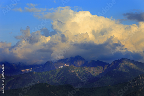 Fototapeta Naklejka Na Ścianę i Meble -  Poland, Tatra Mountains, Zakopane - Kasprowy Wierch, Beskid, Skrajna Turnia, Swinica and Koscielec peaks - High Tatra under clouds